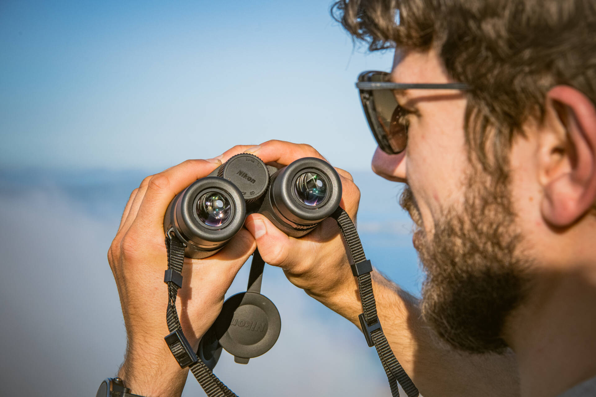 image of man with nikon binoculars