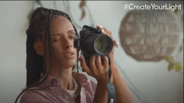 YouTube Thumbnail of Delphine Diallo using the Nikon Z 7II in her Create the Light video. 